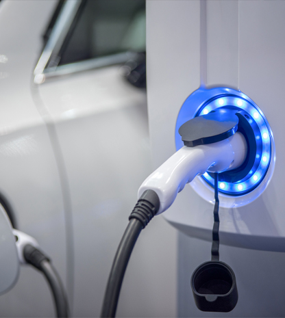 Photo of an electric charging port connected to ev vehicle