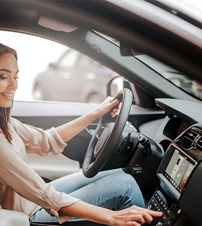 Woman adjusting temperature in car