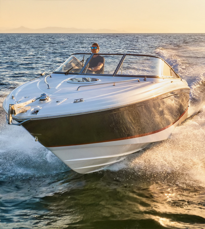 Man piloting speedboat