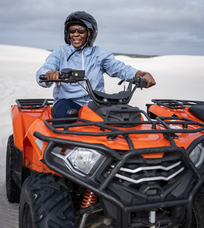 Person on 4-wheeler in desert