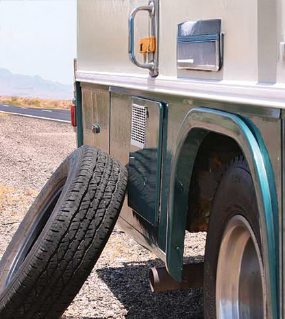 Tire leaning up against RV